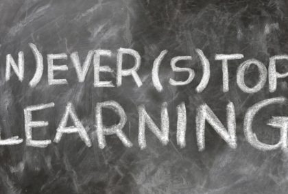 a blackboard showing the text - "never stop learning"